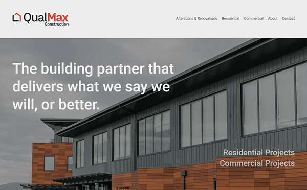 Front of a commercial building with the QualMax Construction logo and website sections visible. The text reads, "The building partner that delivers what we say we will, or better.