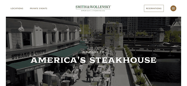 The image of Smith & Wollensky steakhouse's website showcases one of the best restaurant websites, highlighting its inviting outdoor dining area by a serene river. The text warmly welcomes you to America’s Steakhouse, with options for Locations, Private Events, and Reservations.