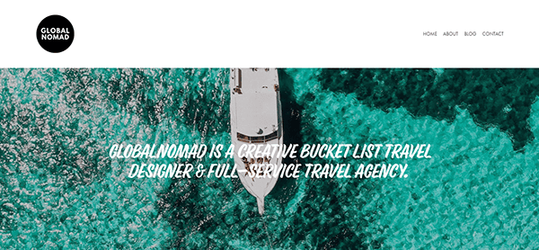 A boat sails on clear, turquoise water. Overlay text reads "Global Nomad is a creative bucket list travel designer & full-service travel agency." The top right has navigation links: Home, About, Blog, Contact.