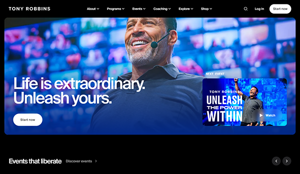 A smiling man with a headset is in front of a blue backdrop featuring the text "Life is extraordinary. Unleash yours." A sidebar promotes an event titled "Unleash the Power Within.