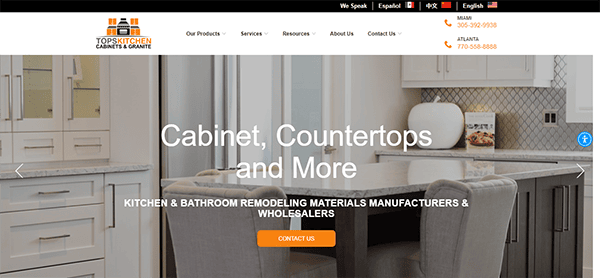 Website screenshot of Tops Kitchen, Cabinets & Granite. The homepage features a kitchen with modern cabinetry and countertops, offering remodeling materials and wholesaling services. Contact numbers for Miami and Atlanta are provided.