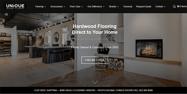 A modern showroom interior with hardwood flooring, a fireplace, and wood stacks. The Unique Wood Floors website displays a promotional banner for hardwood flooring services.