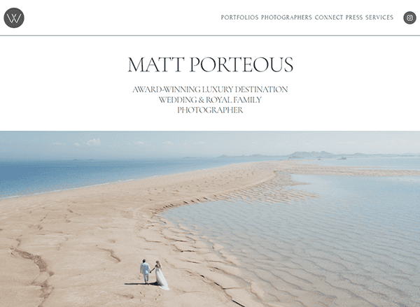 A couple walks along a sandy beach with clear blue water under a bright sky. Text above names Matt Porteous as an award-winning luxury destination wedding and royal family photographer.