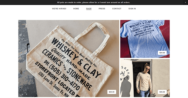 Discover Whiskey & Clay's artisan website, showcasing curated tote bags and t-shirts. Featuring a storefront tote, a printed text tee, and a stylish individual outdoors sporting sunglasses and one of our unique t-shirts.