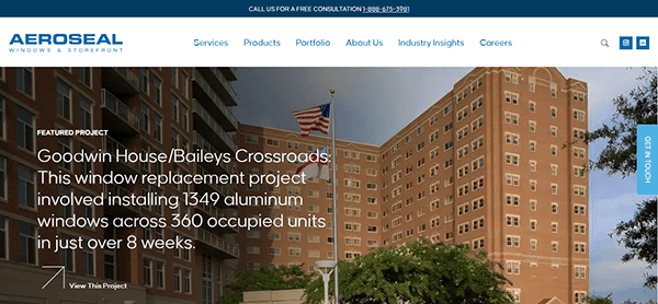 A building adorned with a United States flag showcases a window replacement project by Aeroseal, highlighting their expertise as one of the best in window repair while menu options at the top of this exemplary window repair website offer seamless navigation.