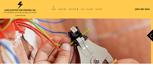 Close-up of hands using a wire stripper tool on yellow and green electrical wires.