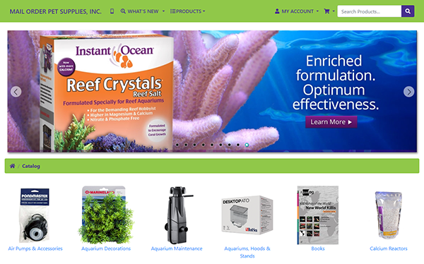 Screenshot of a pet supplies website featuring a banner ad for reef crystals reef salt. Below the banner are categories including air pumps, aquariums, decorations, maintenance, stands, books, and calcium reactors.