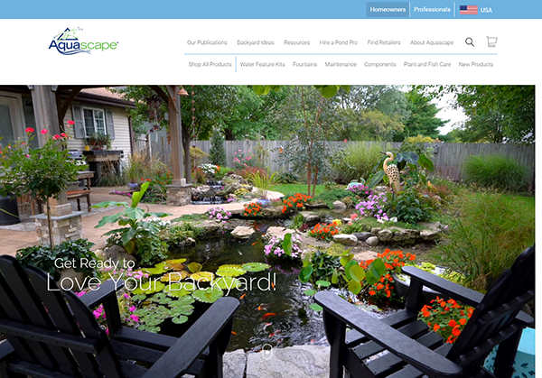 A backyard pond with water lilies, colorful flowers, and decorative elements is surrounded by greenery and a patio with chairs. The website header features navigation links and the USA flag.