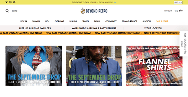 A screenshot of the Beyond Retro website homepage featuring the September Drop with clothing items displayed for men and women, and a promotion for flannel shirts.