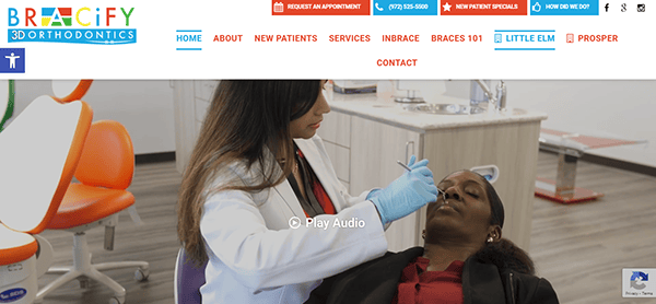 A dentist in a white coat examines a patient lying in a dental chair. The background shows various dental tools and equipment.