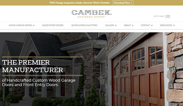 Welcome to Gambek Designer Doors, where you can explore the best garage doors crafted for elegance and durability. Our homepage features a stunning stone house with wooden garage doors, showcasing our expertise as the premier manufacturer of handcrafted custom wood garage and front entry doors.