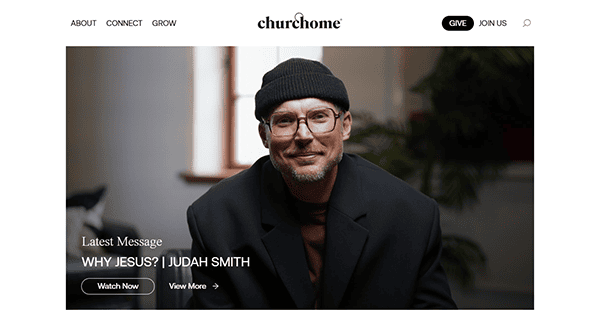 Homepage of a website featuring a photo of a man in glasses and a beanie. Text reads "Latest Message: Why Jesus? | Judah Smith" with options to "Watch Now" or "View More." Navigation links are visible.