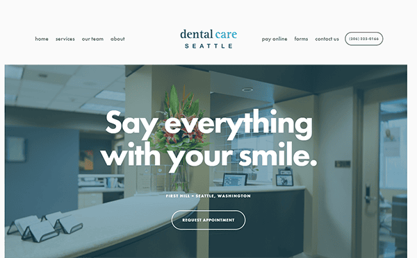 A modern dental office website with a banner quote, "Say everything with your smile." The page includes navigation links and a phone number at the top. The design is minimalist with a professional tone.