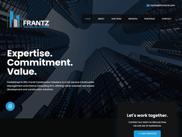 A website homepage for Frantz Construction Solutions, displaying skyscrapers, company tagline "Expertise. Commitment. Value." with navigation links, a contact email, and a section to contact the team.