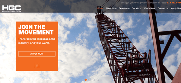 Image of a construction company's website homepage featuring a crane against a blue sky with clouds. The site includes navigation links and a prominent call-to-action button stating "Join the Movement.