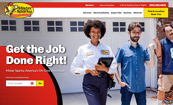 Mister Sparky electrician holding a clipboard and smiling next to a man in front of a garage. Text: "Get the Job Done Right! Mister Sparky, America's On-Time Electrician." Search and contact options are displayed.