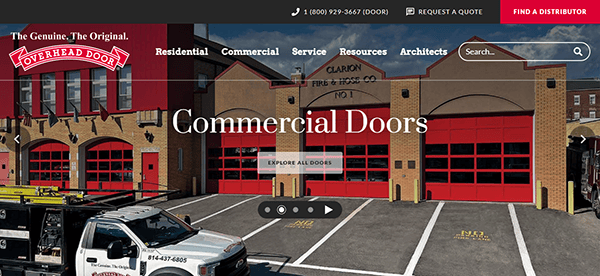 The website homepage proudly showcases a red-brick fire station with striking red doors, underlining the text "Commercial Doors." Navigate effortlessly to explore sections like Residential, Commercial, Service, Resources, and Architects—all crafted for the best garage door experience.