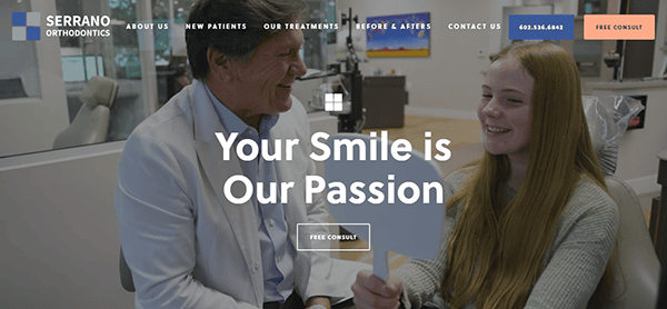 Orthodontist in a white coat smiles at a young patient holding a mirror. Text overlay reads, "Your Smile is Our Passion." The website menu and contact information are displayed above.