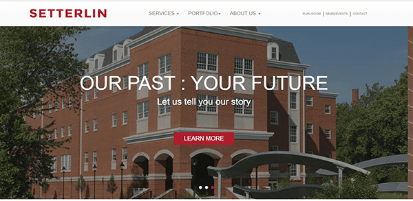 A red brick building with the text "OUR PAST: YOUR FUTURE" and "Let us tell you our story" on the facade. The website menu includes Services, Portfolio, About Us, and Contact options.