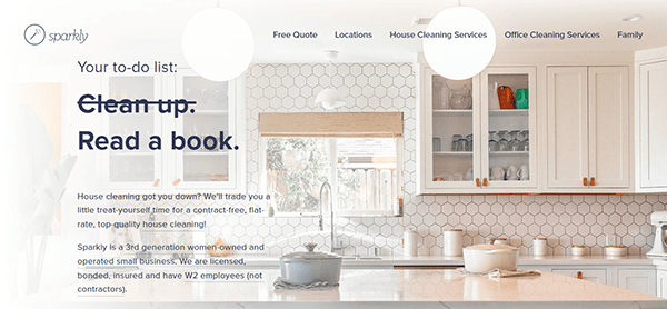 A kitchen with white cabinetry, hexagonal backsplash tiles, and modern light fixtures. A window looks out to a garden. Overlaid text promotes cleaning services and a company named Sparkly.