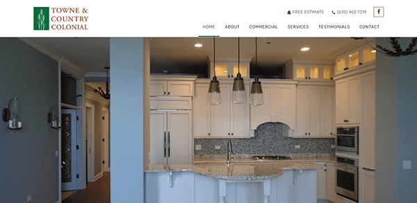 A screenshot of the Towne & Country Colonial website homepage, featuring a kitchen with white cabinets, granite countertops, pendant lights, and contact details at the top right.