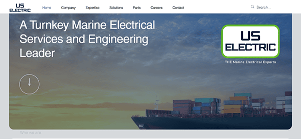 Screenshot of a webpage for "US Electric". The page headline states "A Turnkey Marine Electrical Services and Engineering Leader," with an image of a cargo ship and containers in the background.