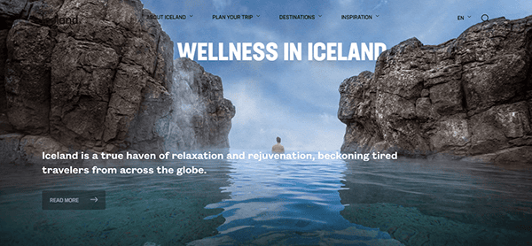 Person swimming between rocky cliffs in Iceland with the text "WELLNESS IN ICELAND" and "Iceland is a true haven of relaxation and rejuvenation, beckoning tired travelers from across the globe.