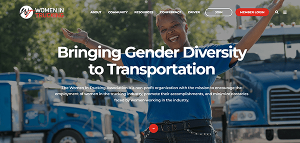 A smiling woman stands in front of blue trucks with arms outstretched. Text reads: "Bringing Gender Diversity to Transportation" and describes the mission of the Women in Trucking Association.