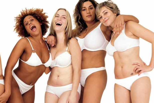 Four women in white bras and panties pose together against a white background, embodying an effective campaign strategy that captures attention and elevates the essence of impactful social media advertising.