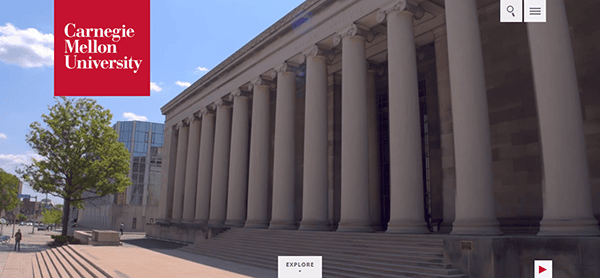 A large building with tall columns and a red Carnegie Mellon University banner is prominently featured on the best college websites. A tree and modern glass structure sit to the left, while steps lead invitingly up to the entrance.