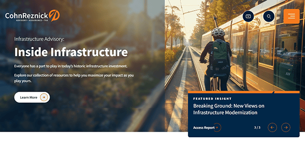 A person wearing a helmet rides a bicycle alongside a tram on a sunlit street. The image, linked to insights on infrastructure investment, reminds one of the precision found in the best accounting firm websites: seamless, efficient, and thoughtfully designed.