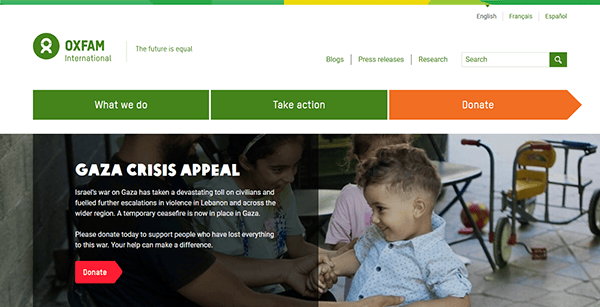 Oxfam International's charity website features a Gaza crisis appeal, complete with a donation button and heartwarming image of children playing outside.