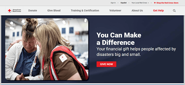 The American Red Cross webpage, one of the best charity websites, features a comforting image of two people embracing on the left and a compelling call to donate on the right.