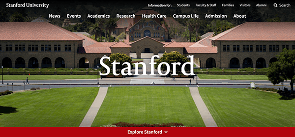 View of Stanford University's main campus entrance with large buildings and expansive green lawn; a prime example of the best college websites, offering intuitive menu options and links overlaid at the top.