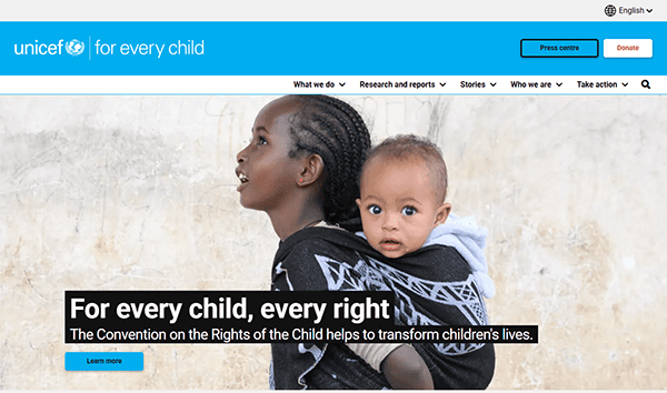 A woman carries a baby in a wrap on her back. Text reads: "For every child, every right. The Convention on the Rights of the Child helps to transform children's lives." Discover how this best charity makes a difference. UNICEF logo at the top.