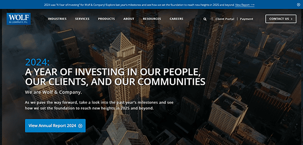 Aerial cityscape with "Wolf & Company" branding overlay, showcasing their 2024 investment focus on people, clients, and communities. Recognized as a Best Accounting Firm, they invite you to view the Annual Report 2024 with just a click.