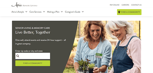 Two women enjoying gardening on one of the best assisted living websites, where senior living and memory care resources abound, like finding a community and accessing a caregiver's guide.