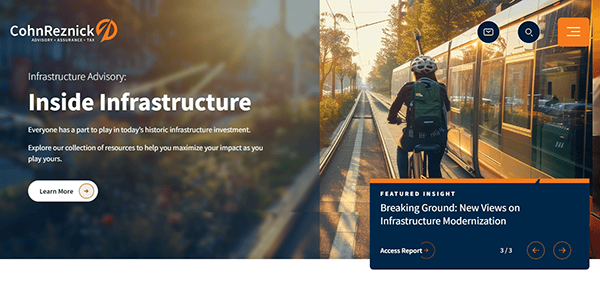 Cyclist rides alongside a city tram. Text overlay reads: "Inside Infrastructure: Breaking Ground with New Views on Modernization." Discover why CohnReznick is the best advisor for infrastructural innovation, where expertise meets excellence. CohnReznick logo.