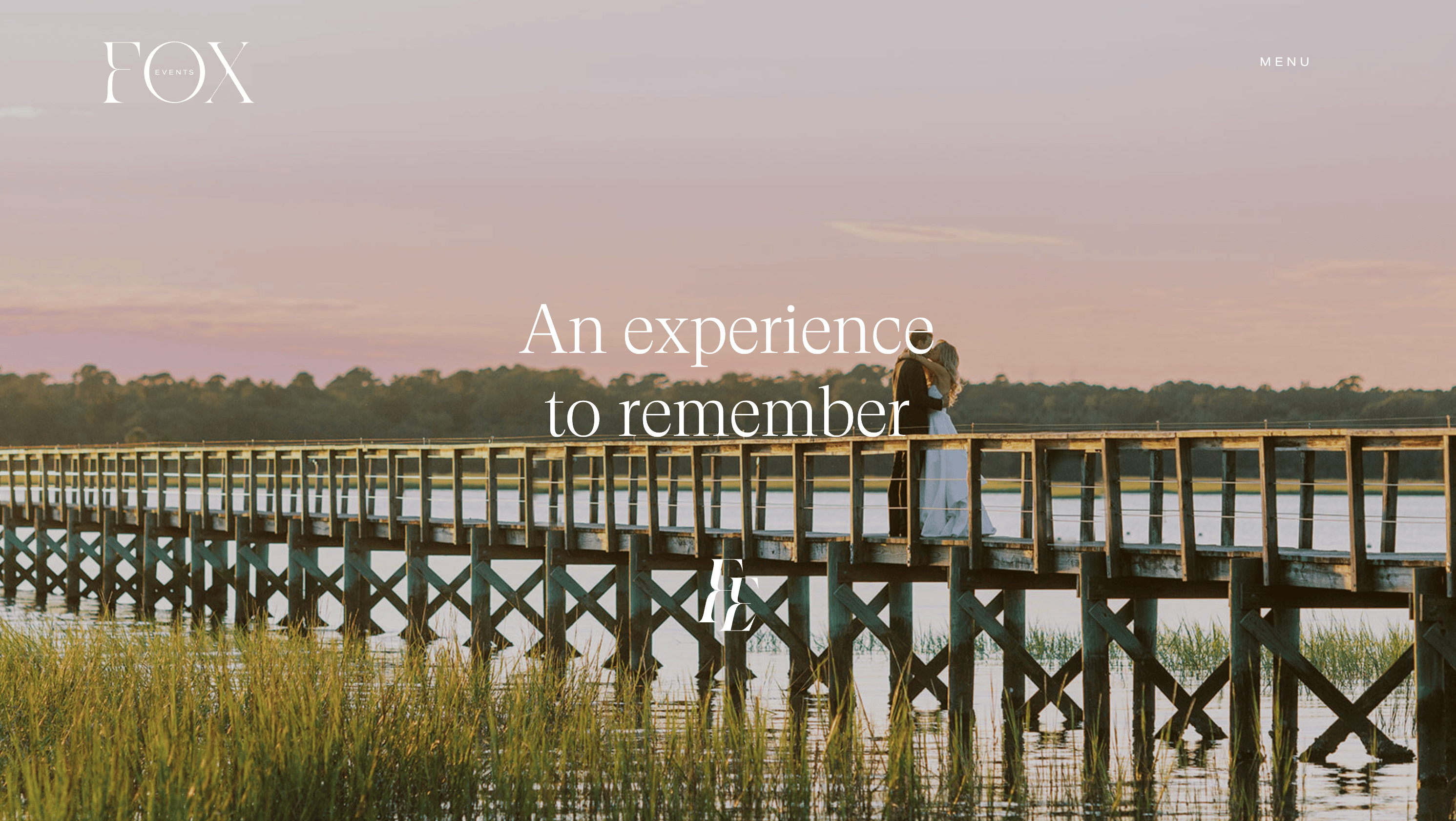 A couple stands on a long wooden pier at sunset, with text overlay reading "An experience to remember, crafted by the best event planners.